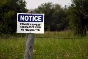 How do I resolve a warrant for trespass after forbidden in Okmulgee lawyer?